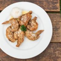 Garlic Parmesan Chicken Wings · Classic bone-in chicken wings oven baked to perfection then smothered in garlic parmesan mar...