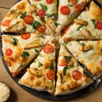 Chicken Alfredo Pizza (Gluten Free) · Grilled chicken, spinach, and creamy alfredo sauce on a fresh baked pizza.