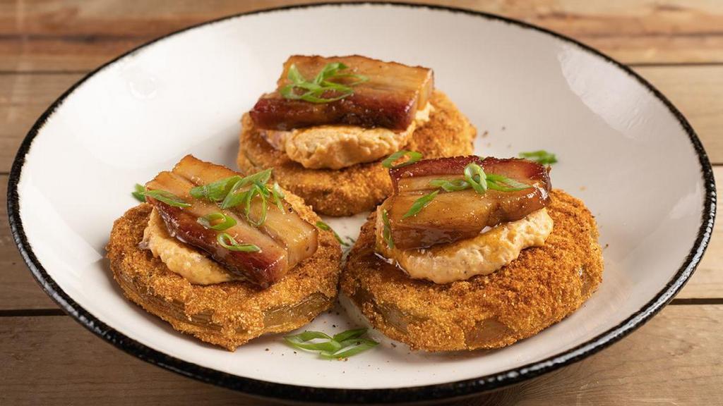 Fried Green Tomato Stacks · Old Bay dusted fried green tomatoes, house-made pimento cheese, spicy glazed pork belly, scallions, smoked onion ranch