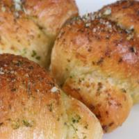 Garlic Knots · Fresh, home-made knots with our famous garlic sauce.