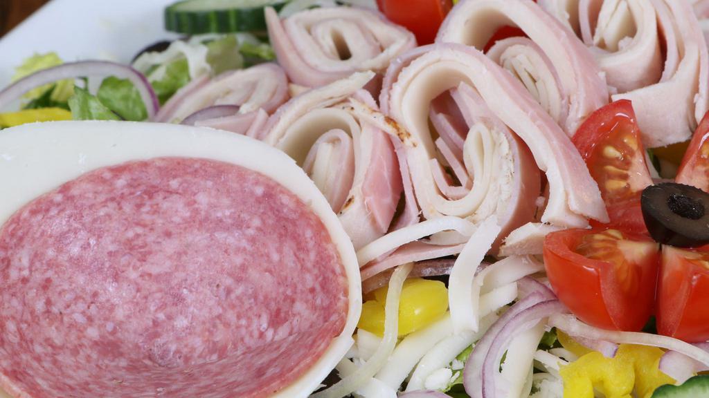 Side Chef Salad · Genoa salami, ham, turkey and provolone cheese served on a bed of romaine or iceberg blend lettuce, shredded mozzarella, cucumbers, onions, tomatoes, black olives and banana peppers.