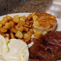 Steak Breakfast · Our delicious 8oz. top sirloin cooked to order and served with a buttermilk biscuit, two egg...