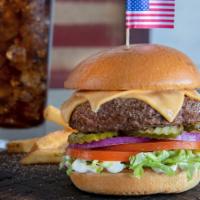 All-American Burger™ · A Shoney's® classic served with American cheese. Served on a toasted bun with lettuce, tomat...