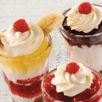 Classic Sundaes · Our sundaes are made with scoops of vanilla bean ice cream and finished with whipped topping...