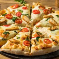 Chicken Alfredo Pizza · Delicious pizza with alfredo sauce with grilled chicken and spinach.