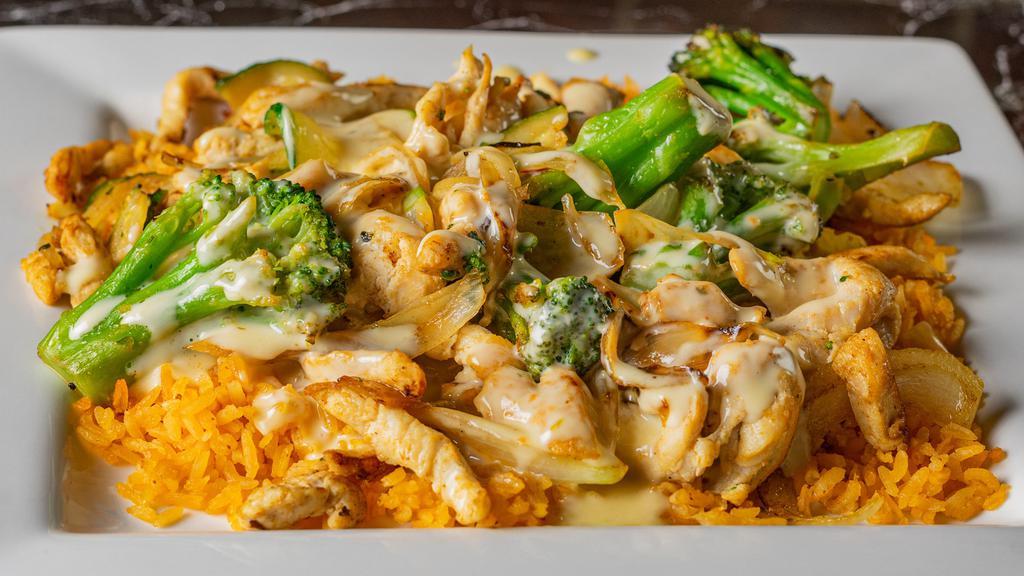 Arroz Con · Your choice of grilled meat sautéed with onions, broccoli and zucchini. Served on a bed of rice and topped with cheese sauce.