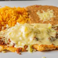 Choripollo · Grilled chicken breast sautéed with Mexican chorizo. and topped with melted cheese. Served w...