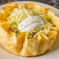 Taco Loco · A large crispy flour tortilla filled with shredded chicken. or ground beef topped with shred...