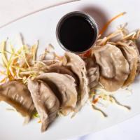 Pot Stickers (6) · Vegetarian. Green onion, ginger, napa cabbage and soy sauce wrapped in dumpling skins with p...