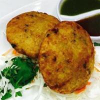 Aloo Tikki · Vegetarian. Vegan. Gluten free. Spiced patties of potato served with chutney.