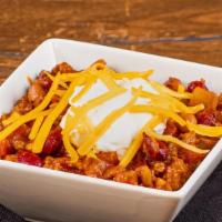 Steakhouse Chili · Hereford ground beef combined with seasonings, peppers, onions, and tomato topped with Chedd...