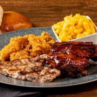 Ultimate Baby Back Rib Combo · 1/4 rack of ribs, grilled chicken breast, and fried jumbo shrimp. For when you want a taste ...