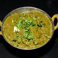 Palak Paneer · Homemade cheese cubes gently cooked with garden spinach and mild spices.