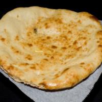 Naan · Traditional bread baked in the tandoor.