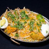 Chicken Biryani · Basmati rice cooked with chicken and then mixed with onions, fresh ginger, and finally flavo...
