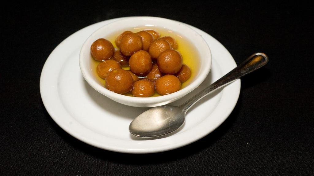 Gulab Jamun · An indian sweet consisting of a ball of deep-fried cheese boiled in a heavy sugary syrup.