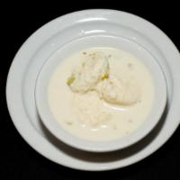 Rasmalai · Cottage cheese simmered with thickened and sweetened milk and nuts – served cold.