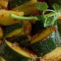 Smashed Cucumber · English cucumbers sliced and marinated in our Sichuan chili oil. A little spicy. Served chil...