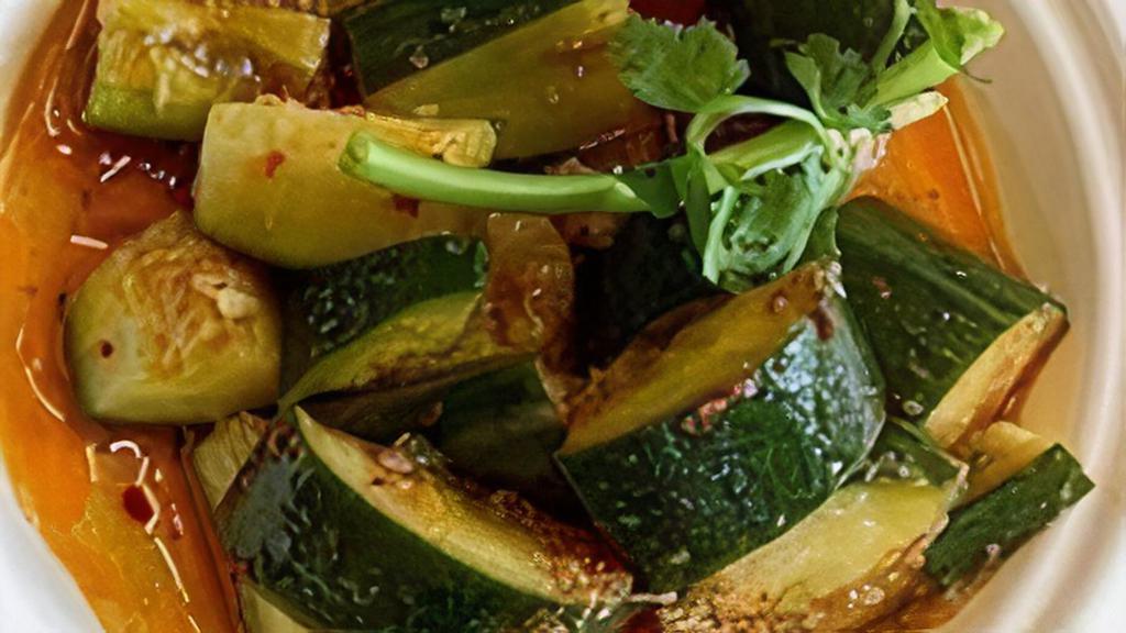 Smashed Cucumber · English cucumbers sliced and marinated in our Sichuan chili oil. A little spicy. Served chilled