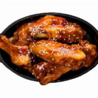 Bone-In Wings · Classic bone-in wings oven-baked, cooked to order perfectly crisp, tossed with your choice o...
