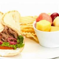 Grilled Beef Gyro · Taziki sauce, tomatoes, mixed lettuce, and grilled onions with chips and your choice of a ho...