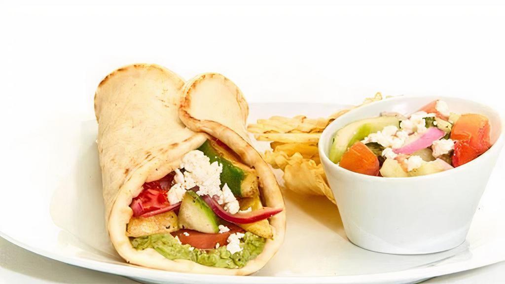 Greek Salad Gyro · Tomatoes, cucumbers, roasted red peppers, red onions, mixed lettuce, feta, and Greek dressing. Served with chips and your choice of a homemade side.