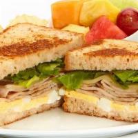 Turkey & Egg Sandwich  · Mayo, swiss, and mixed lettuce on toasted bread. Served with chips and your choice of a home...