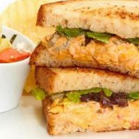 Spicy Pimento Cheese Sandwich  · With mixed lettuce on toasted bread. Served with chips and your choice of a homemade side.