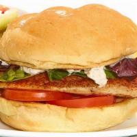 Grilled Tilapia Sandwich · With caper-dill tartar sauce. Grilled and served with tomato and lettuce on a kaiser bun. Se...