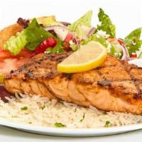 Grilled Salmon Feast · Seasoned chargrilled blackened salmon. Served with a salad, a baked pita chip, and your choi...