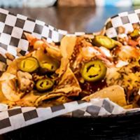 Bbq Nachos · Tortilla chips covered with pulled pork, cheese, bbq sauce drizzle, jalapeños (on the side).