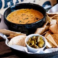 Queso Dip · Served with tortilla chips.