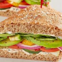 The Veggie · Spinach, tomato, cucumber, red onion, house-roasted multicolored peppers, avocado and herb m...