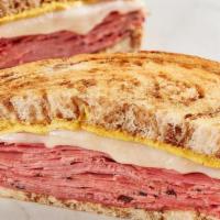 The New Yorker · Corned beef, pastrami, Swiss and spicy brown mustard on marbled rye.