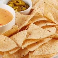 Nacho Basket · RO*TEL cheese dip, jalapeños and tortillla chips.