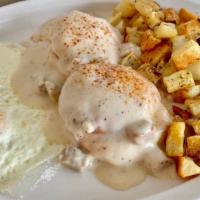Homestead Breakfast · Two fluffy buttermilk biscuits topped with sausage gravy served with two farm fresh eggs and...