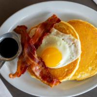 Pancake Sandwich · Two plain handspun pancakes served with a farm fresh egg and a choice of two strips of bacon...