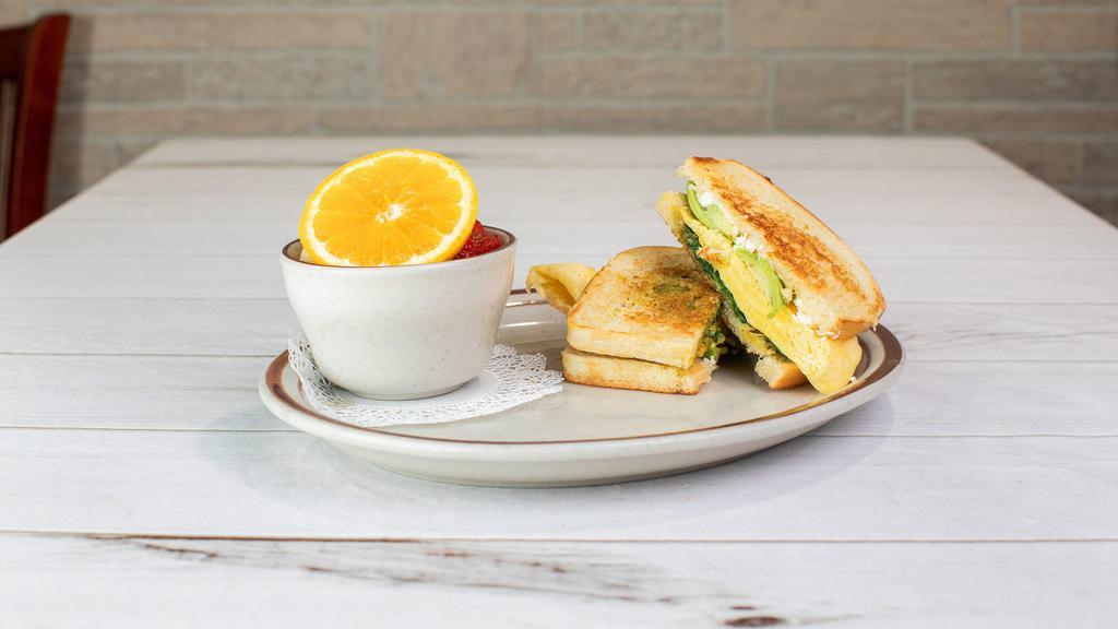 New - Spinach, Pesto Breakfast Sandwich · Sourdough toast stuffed with sautéed spinach with a touch of fresh basil pesto, mashed avocado, scrambled eggs with feta cheese. Served with fresh fruit.