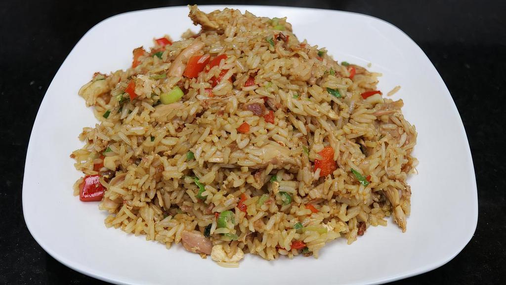 Chaufa Rice · Pulled rotisserie chicken | fried rice | bacon | green onions | red peppers | egg | peruvian soy sauce.