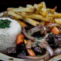 Crazy Lomo · (stir fried beef) marinated beef | red onions | tomatoes | cilantro | soy sauce | rice & one...