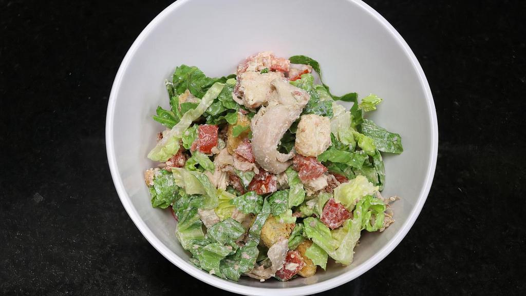 Caesar · Pulled rotisserie chicken | bacon | romaine lettuce | diced tomatoes | croutons | caesar dressing.