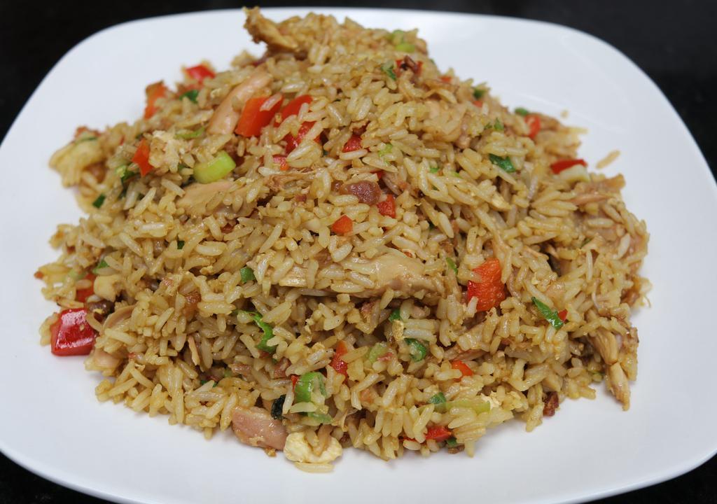 Chaufa Rice · Fried rice. pulled rotisserie chicken fried rice bacon green onions red peppers egg and peruvian soy sauce.