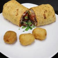 Lomo Wrap · Marinated beef | white rice | tomato | onion | choice of spinach or sundried tomato wrap.