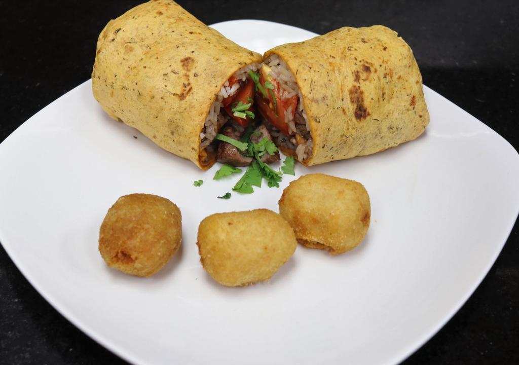 Lomo Wrap · Marinated beef | white rice | tomato | onion | choice of spinach or sundried tomato wrap.