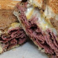 Far East Rueben · Beer-braised corned beef, collard green kimchi, Swiss cheese, special sauce on grilled rye