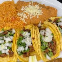 #1 · Four tacos, rice and beans.