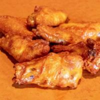 Wings · Crispy bone-in wings tossed in your choice of buffalo, BBQ, spicy thai or teriyaki. Includes...