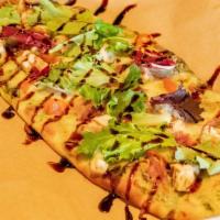 Basil Pesto Chicken Flatbread · Basil pesto, mozzarella, chicken, diced tomatoes and bacon. Garnished with spring mix and ba...