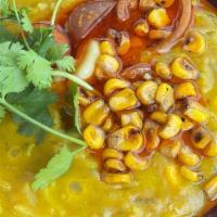 Khichdi · Toor dal porridge with rice, corn, confit tomato, and ghee.