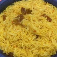Turmeric Rice · Basmati rice, fresh turmeric, golden raisins, ghee.
